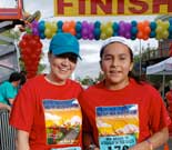 Two happy runners celebrate their finish