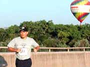 Running along with balloons